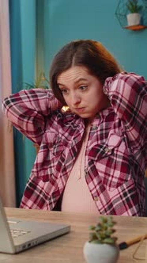 Tired Businesswoman Suffers From Spine Neck Muscle Pain at Home Office Workplace Overworking