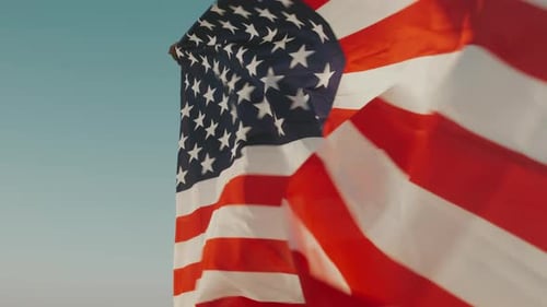 American Flag Waving in the Wind at Sunset