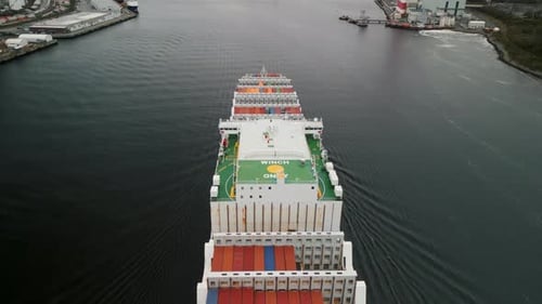 Cargo Ship Cutting Through Ocean Waves Aerial View Of Freight Route