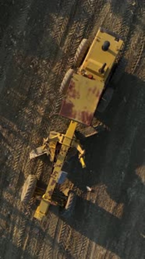 Vertical Video Old Grader in Action Aerial View of Historic Machinery