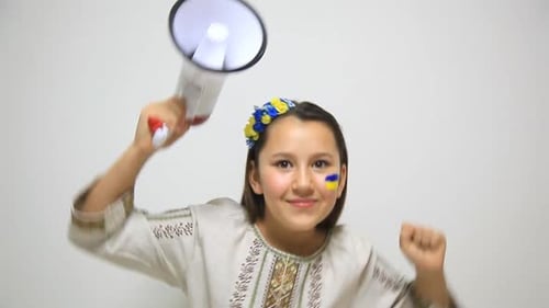 Smiling Child Waving Megaphone in Front of White Background