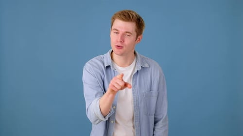Insulted Caucasian Male Being Angry and Annoyed in Studio