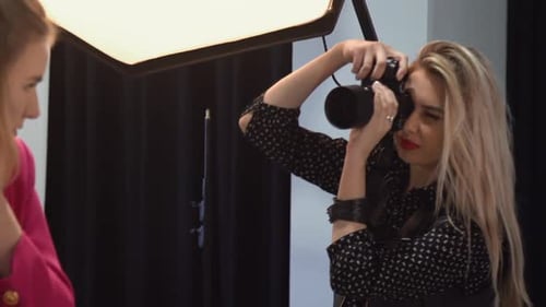 Photographer Working in Photography Studio With Model