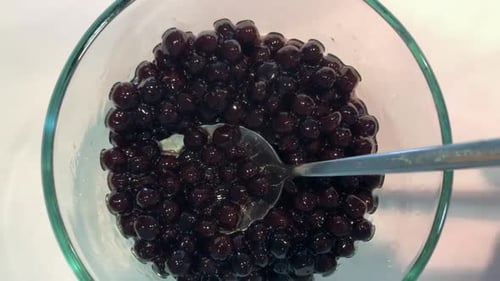 Asian tapioca balls also known as boba pearls on a white background. Overhead view.