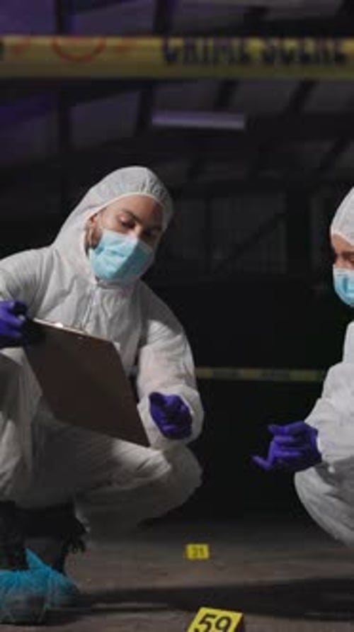 Forensic Investigators Examine Crime Scene Evidence at Night
