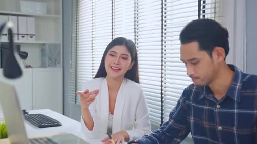 Asian young businessman and businesswoman people working in office.