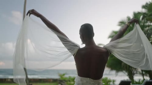Bride in White Dress by Tropical Ocean