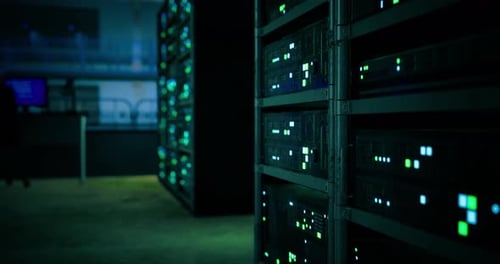 Data Center Filled with Servers and Glowing Lights at Nighttime