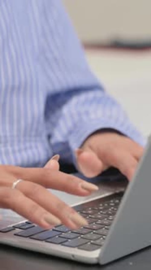 Close up of Female Hands Typing on Laptop, vertical video