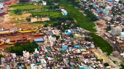 Vista Of Slums Area In The Urban Of DhakaIn Bangladesh, Asia. Aerial Shot Along Buriganga River