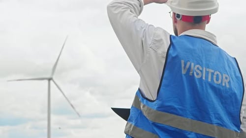 An Inspection Engineer Oversees the Operation of Wind Farms