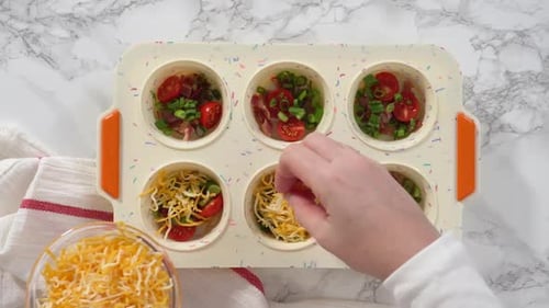Preparing Delicious Egg Bites with Cheese and Vegetables