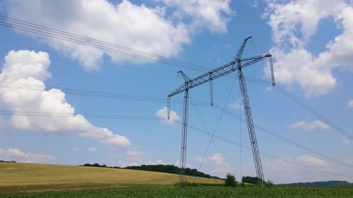 Tower with Electric Power Lines for Transfering High Voltage Electricity Located in Agricultural