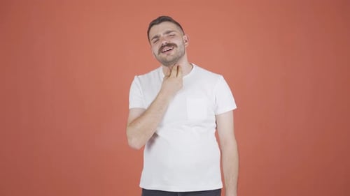 Young Adult Man With a Sore Throat