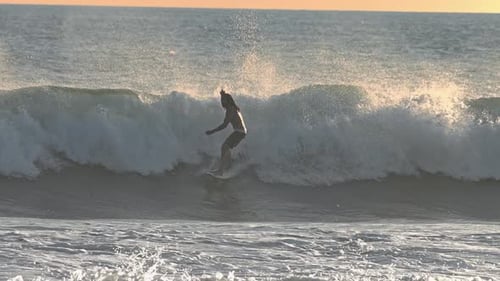 Surfer Riding on Surfboard in Beautiful Ocean Waves Slow Motion