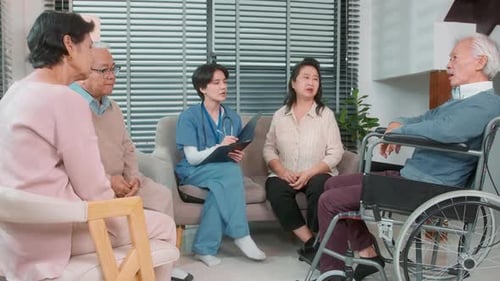 Medical Professional Talks with Elderly Patients