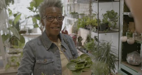 Cashier Helping Customer in Plant store