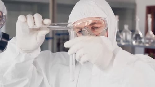 Scientists Working in Lab with Test Tubes