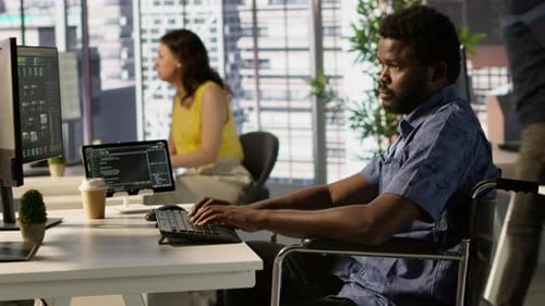 Software Technician with Disability in Inclusive Workplace Working