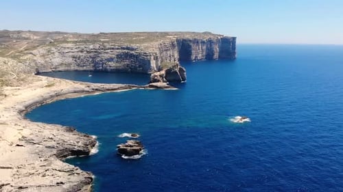 Natural wonder drone aerial pan forward shot birds view of cliffs in island Gozo, Malta