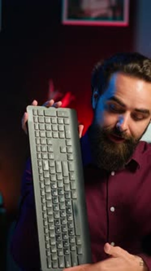 Young Adult Presenting Computer Keyboard and Mouse