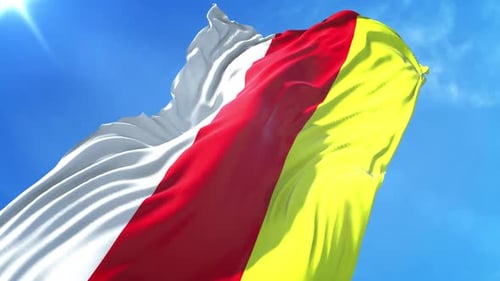 South Ossetia Flag Waving Against Blue Sky
