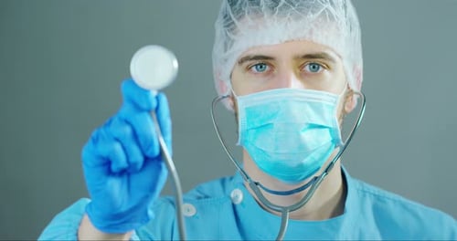 Close Up of Medical Professional Holding Stethoscope