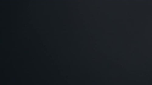 Multiple lightning bolts illuminating the night sky during storm.