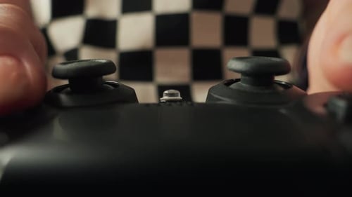 Hands of gamer holding modern console close-up, girl playing video games.