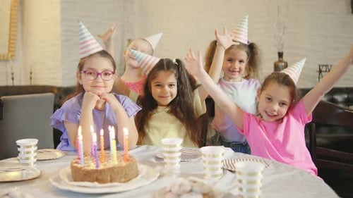 Smiling Children Celebrating Birthday Party with Cake