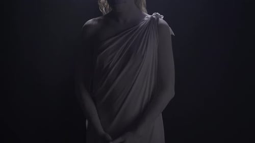 Human Marble Statue of Themis in Dramatic Lighting