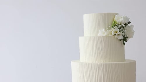 Elegant Wedding Cake with Flowers Rotating Slowly