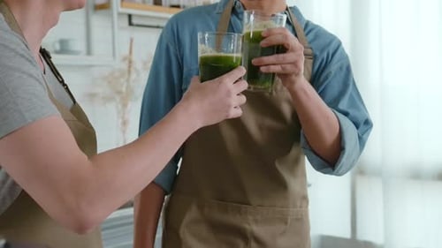 Friends Drink Green Juice in Kitchen