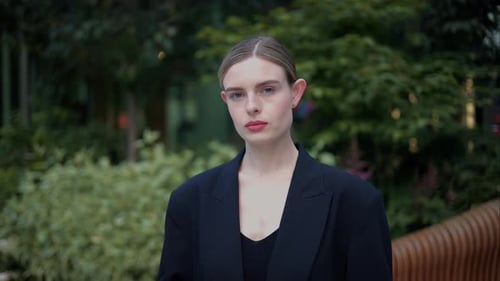 Confident Woman Posing in Urban Outdoor Setting