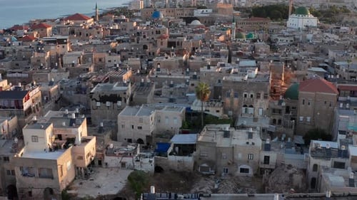 Acre old city port houses and Mosque at sunrise, Aerial view