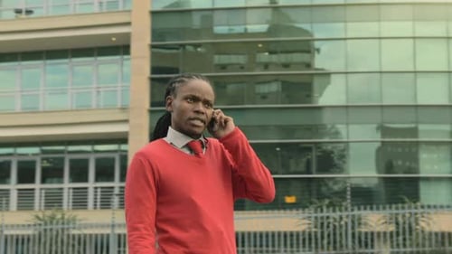 Man talking on cell phone in urban setting