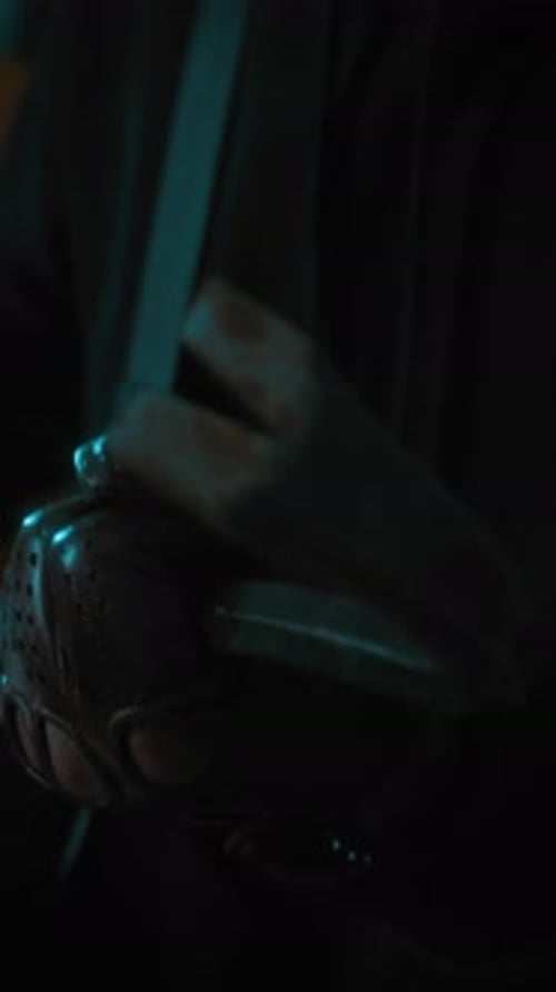 Close-up of Hand of Unknown Bandit in Leather Gloves with Metal Crowbar
