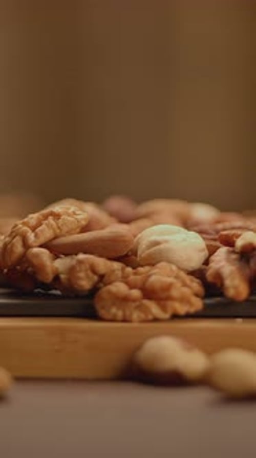 A Beautifully Arranged Plate of Assorted Nuts Perfect for Healthy Snack Inspiration