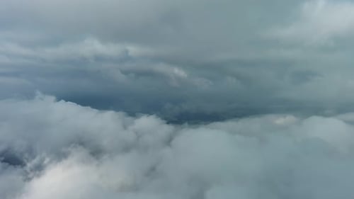 Aerial High View of Dramatic Clouds Flying