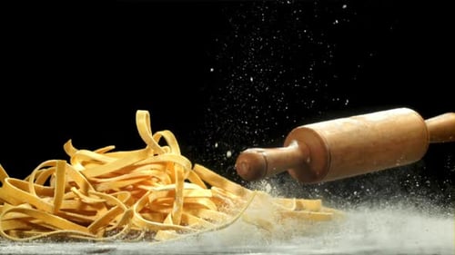 The Rolling Pin Falls on the Table with Flour Filmed on a Highspeed Camera at 1000 Fps