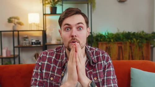 Young Man Reacts with Shock and Amazement