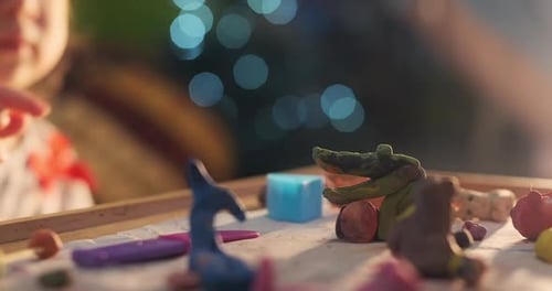 Child Playing With Clay on Christmas Eve