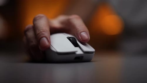 Closeup Hands of Unrecognizable Male Gamer Playing in Games Sitting at Desk with Computer Desktop Pc