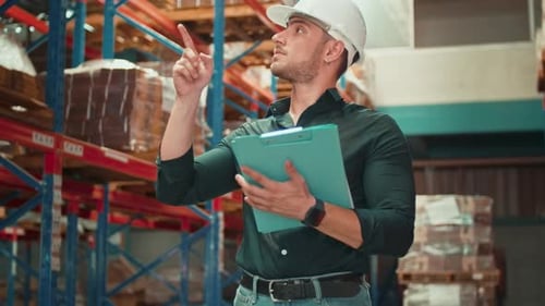 Portrait of young Caucasian male worker wearing helmet