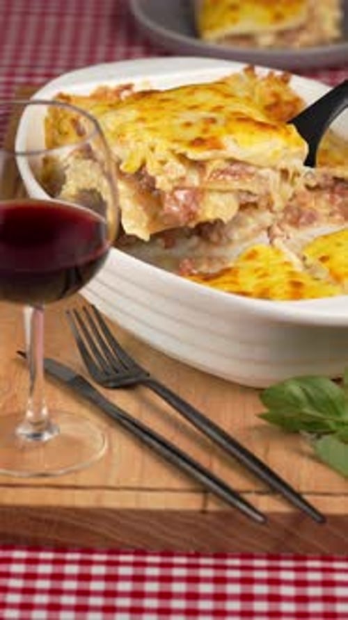 Delicious Lasagna Dish and Red Wine Glass