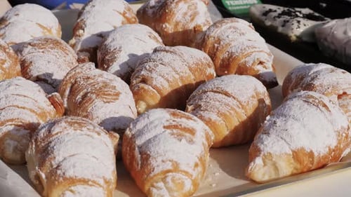 Close Up Taking Out Tasty Golden Croissants in French Spanish Bakery Traditional France Cuisine