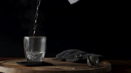 Steaming Water Poured into Clear Glass Mug