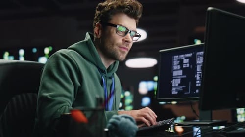 Datacenter Analyst Looking Monitors in Advanced Monitoring Office Closeup