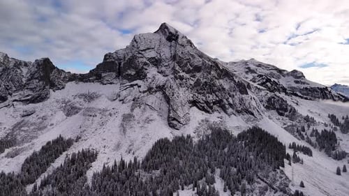 Glarus Alps Fronalpstock winter mountains forest nature snow covered drone view, cold weather Europe
