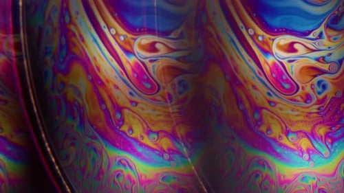 Swirling Multi-Colored Iridescent Liquid Patterns Macro Abstract Background